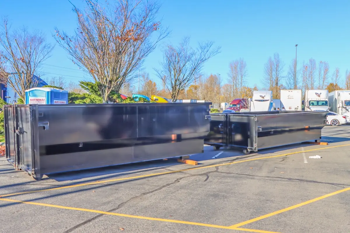 Professional dumpster rental service with roll-off container on residential driveway in Benicia